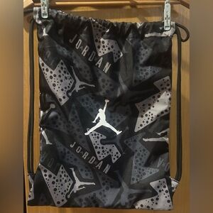Jordan Black and Gray Graphic Drawstring Backpack.